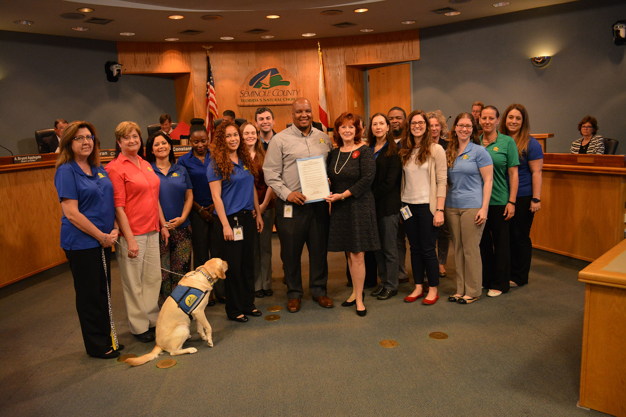 Group photo with service dog at Seminole County recognition ceremony