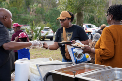 BBQ-attendee-receiving-food-in-line_thumb